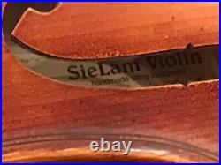 Used Sie Lam Capricoo full size violin with P and H London bow. With case